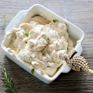 a dish of herbed cream cheese