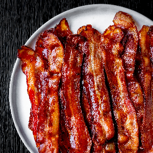 a plate of bacon strips