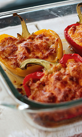 a baking dish of stuffed peppers